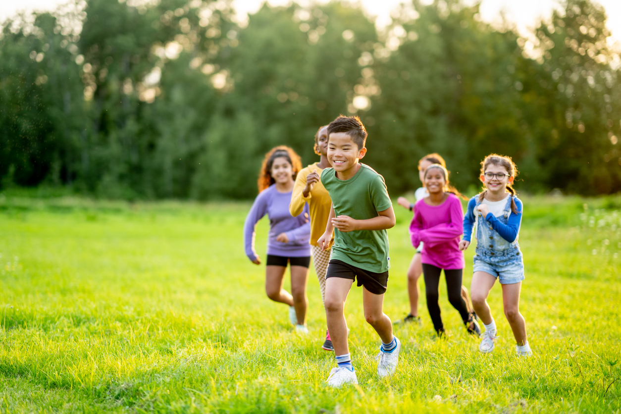 Kids running in the grass