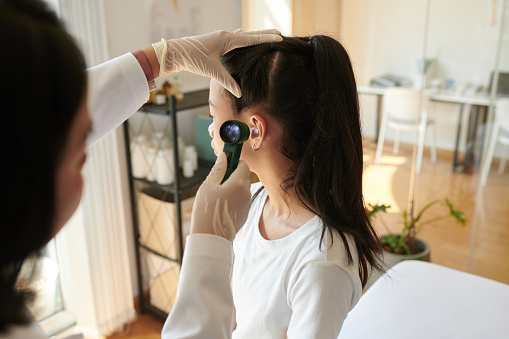 Pediatric ear exam.